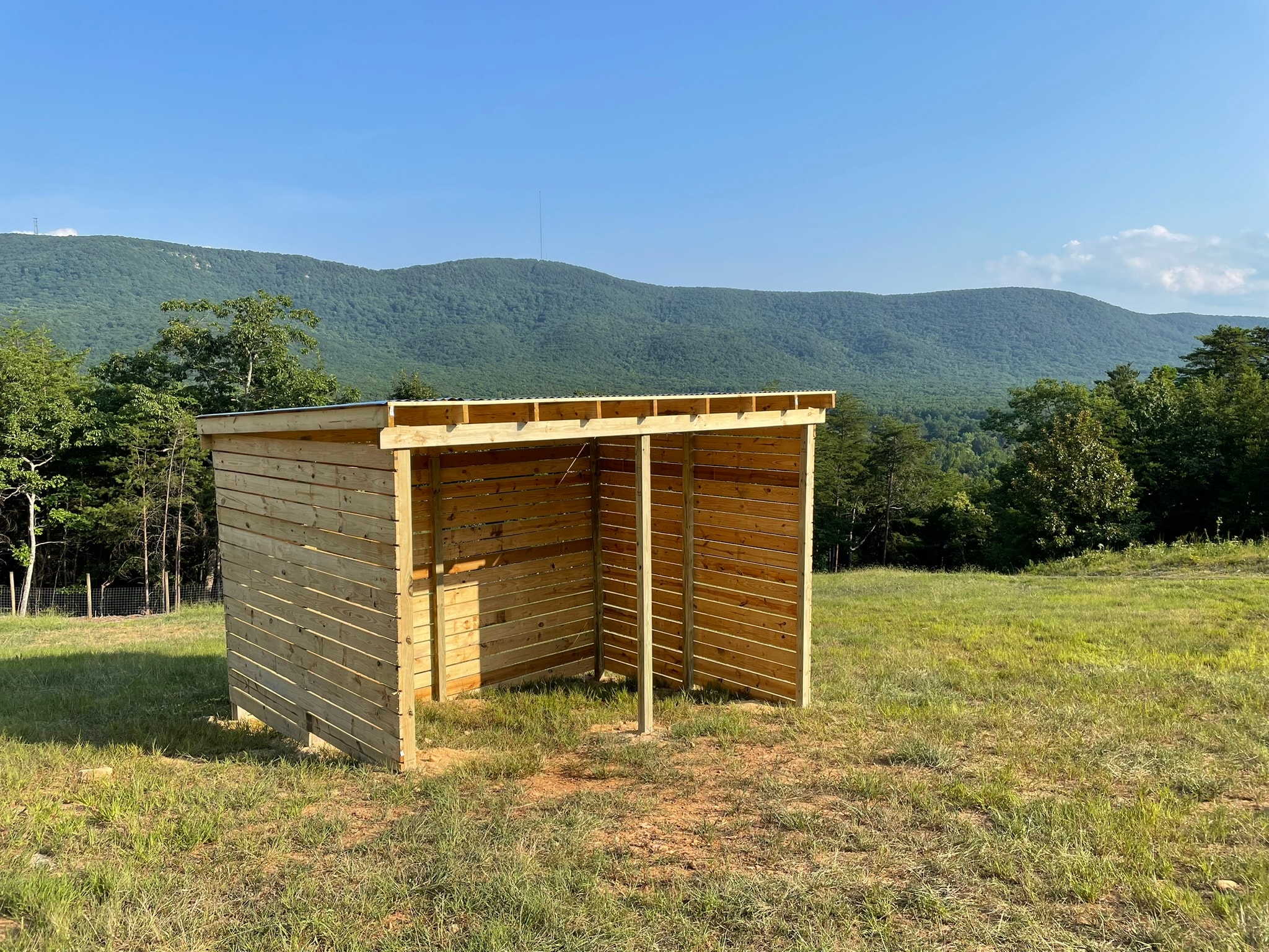 Run-in shed in mountain meadow