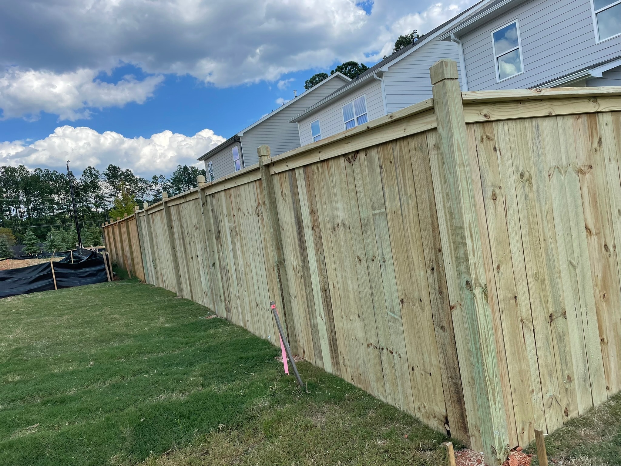 Wooden fence beside residential house
